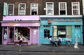 English: Colorfully painted shop windows in a ...