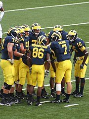 2006 Michigan Wolverines huddle during a game against the Central Michigan Chippewas. 20060909 Michigan Wolverines Huddle with Long, Manningham, Henne and Arrington.jpg