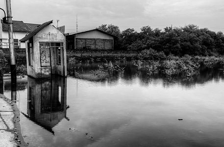 Abandoned guardhouse in a flooded parking lot... spooky