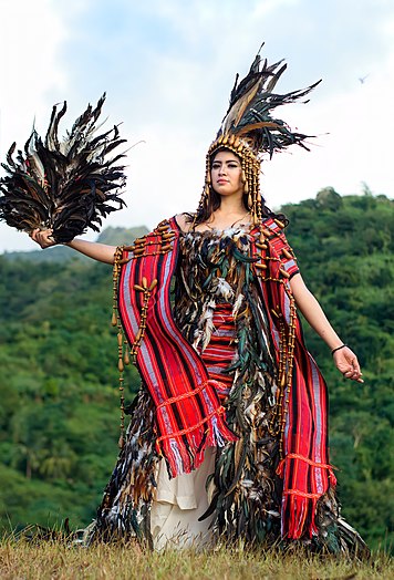 Amihan is depicted as a bird in the Philippine mythology. Her attire was locally designed by Rodel Pagara using chicken feathers. Photograph: Moreno, Edward Joshua A. (CC BY-SA 4.0)