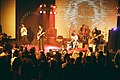 Five men performing at a concert
