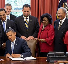 Jealous behind President Barack Obama as he signs the Educational Excellence for African Americans executive order, 2012 Educational Excellence for African Americans Executive Order Signing (cropped).jpg