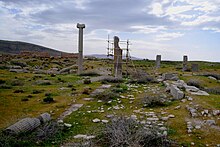 Photograph of three columns of different sizes at Istakhr