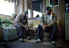 Portrait of Frank N Dank at Frank's Barber Shop in Brooklyn, New York.