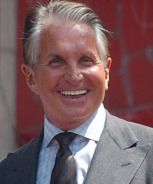 English: George Hamilton receiving a star on t...