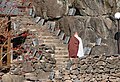 Monk ascending stairway to Jijang Hall