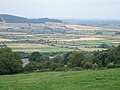 Fields at Stanley Pontlarge viewed from Langley Hill. Looking north to the Vale of Evesham. Note the steam train on the railway