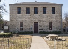 Photograph of the front elevation of a rectangular stone building