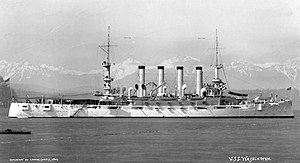 USS Washington (ACR-11) off Seattle, Washington, with the Olympic Mountains in the distance, 1908.