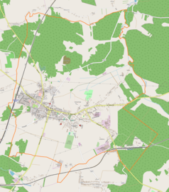 Mapa konturowa Włoszczowy, w centrum znajduje się punkt z opisem „Pozostałości po zabudowaniach obronnych we Włoszczowie”