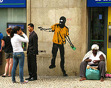 Giving to the Poor, a stencil by American street artist Above addressing the issue of homelessness. Lisbon, Portugal, 2008. ABOVE 2.jpg