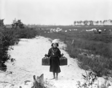 A photograph of a 10-year-old girl in 1912 employed in child labour. Through the passage Factory Acts, the severity and commonality of child labour decreased. ChildLabor1910.png