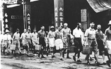 Imperial Japanese soldiers arrested European bankers and detained them in a hotel. Hk japo westerner.jpg