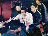 Leslie Cheung with a microphone