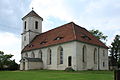 Evangelische Pfarrkirche Baruth mit Kirchhof, Denkmal für die Gefallenen des Ersten Weltkrieges als Türrahmung am Kirchenportal, vier Grabmale auf dem Kirchhof, Soldatengrabanlage für Gefallene des Zweiten Weltkrieges sowie Einfriedungsmauer mit Kirchhofstor