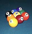 One of many valid racks in the pocket billiards (pool) game of nine-ball; the 1 ball is at the apex of the rack and is on the foot spot, and the 9 ball is in the middle, with all other balls placed randomly, and all balls touching.