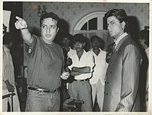 Praveen Nischol directing Shahrukh Khan on the sets of English Babu Desi Mem