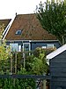 Houten huis met eenvoudige topgevels