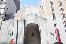 The facade of the Centennial Memorial Temple, which consists of a three-story-high stepped opening surrounded by cast stone