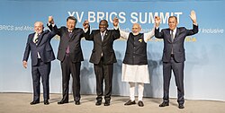 The BRICS leaders and Sergei Lavrov (representing Vladimir Putin). XV BRICS Summit family photo.jpg