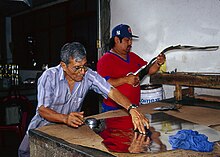 Artisans working with tin sheets Alfonso Santiago Leyva and his son Tomas working.jpg