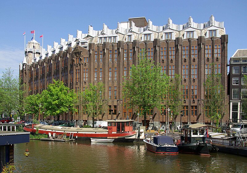 The Scheepvaarthuis, by arhitects Johan van der Mey, Michel de Klerk, Piet Kramer is characteristic of the architecture of the Amsterdam School.