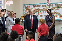 Trump and Secretary of Education Betsy DeVos visit Saint Andrew's Catholic School in Orlando, Florida, March 3, 2017. Betsy DeVos and Donald Trump visit Saint Andrew's Catholic School, March 2017.jpg