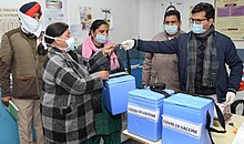 Officials of Jalandhar Civil Hospital hand over the vaccine to the staff of community health centre COVID-19 vaccination in Jalandhar.jpg