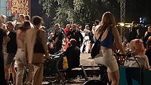 Street party in Copenhagen, Denmark, with police (middle) telling people to leave due to restrictions Corona lockdown party in Copenhagen.jpg