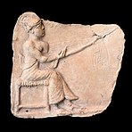 Harpist. Moulded terracotta relief, early 2nd millennium BCE. From Eshunna