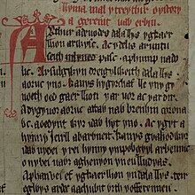 Opening lines of one of the Mabinogi myths from the Red Book of Hergest (written pre-13c, incorporating pre-Roman myths of Celtic gods):
Gereint vab Erbin. Arthur a deuodes dala llys yg Caerllion ar Wysc...
(Geraint the son of Erbin. Arthur was accustomed to hold his Court at Caerlleon upon Usk...) Jesus-College-MS-111 00379 190r (cropped) Geraint.jpg