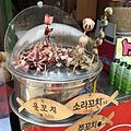 Seafood skewers sold in South Korea, including jju-kkochi (webfoot octopus skewers)