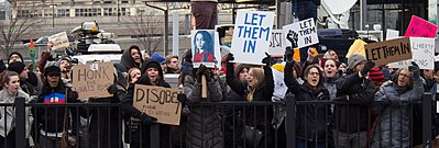 Protesters holding signs outside John F. Kennedy International Airport's Terminal 4 2017-01-28 - protest at JFK (81017).jpg
