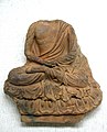 Tile with seated Buddha