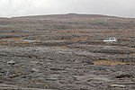 Rocky landscape and a car