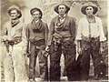 A group of "dudes" posing in chaps and stetsons, c.1910