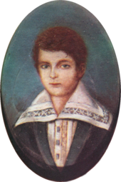 Half-length portrait of a boy with light hair and wearing a jacket over a shirt with an enormous, embroidered collar.