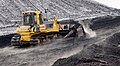 Bulldozer Komatsu D85 PX with semi-U tilt doze pushing coal on Power Station