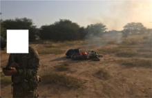 The burning motorcycle in "objective north" Motorcycle destroyed by Team Ouallam and Nigerien force before the Tongo Tongo ambush.png