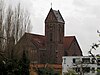 Kerk van St. Nicholaas en Gezellen, in neoromaanse stijl gebouwde kruiskerk.