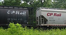 Reporting marks on two Canadian Pacific covered hopper cars; with the left car marked as CP 388686 and the right car marked as SOO 115239 Reporting marks.jpg