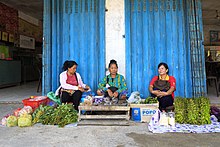 Three Rungus ladies selling home-produced products in Sikuati Town, Sabah, Malaysia. Sikuati Sabah Rungus-Ladies-01.jpg