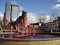 Water in Swansea Castle Square Fountain dyed red for Saint David's Day