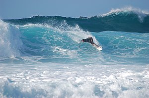 English: A surfer navigating a wave at Banzai ...