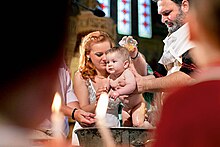 Christening photograph showing the oil moment and Baptism in Greek Orthodox Church The moment of Christening.jpg