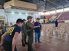 Lanao del Sur governor Mamintal Adiong Jr. inspects the bombing site Adiong MSU bombing.jpg