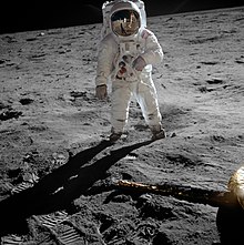 Buzz Aldrin in a spacesuit poses for a photo on the surface of the Moon
