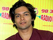 Ali Fazal looking at the camera