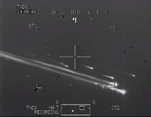 Rare Day TV (DTV) imaging photograph of Columbia's disintegration captured by an AH-64D Apache's gun camera during training with RNLAF (Royal Netherlands Air Force) personnel out of Fort Hood, Texas ColumbiaFLIR2003.png