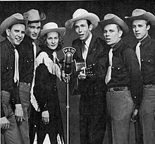 Hank Williams and the Drifting Cowboys performing at WSM in 1951 Hank Williams Drifting Cowboys Cropped.jpg